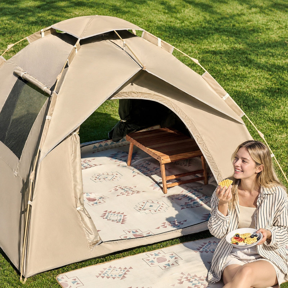 Picnic mat set up inside a pitched tent at dusk