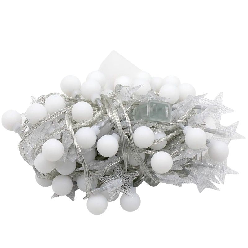 Solar string light set coiled, showing clear star covers and the solar panel