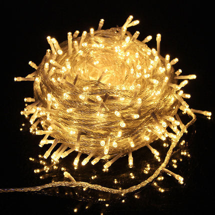 Warm white solar string lights coiled into a bundle