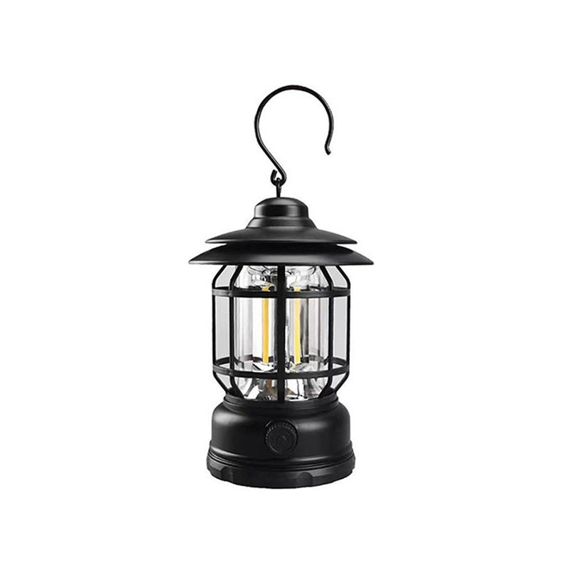 Black retro camp lantern with a steel hook and a glass tube, on a white background